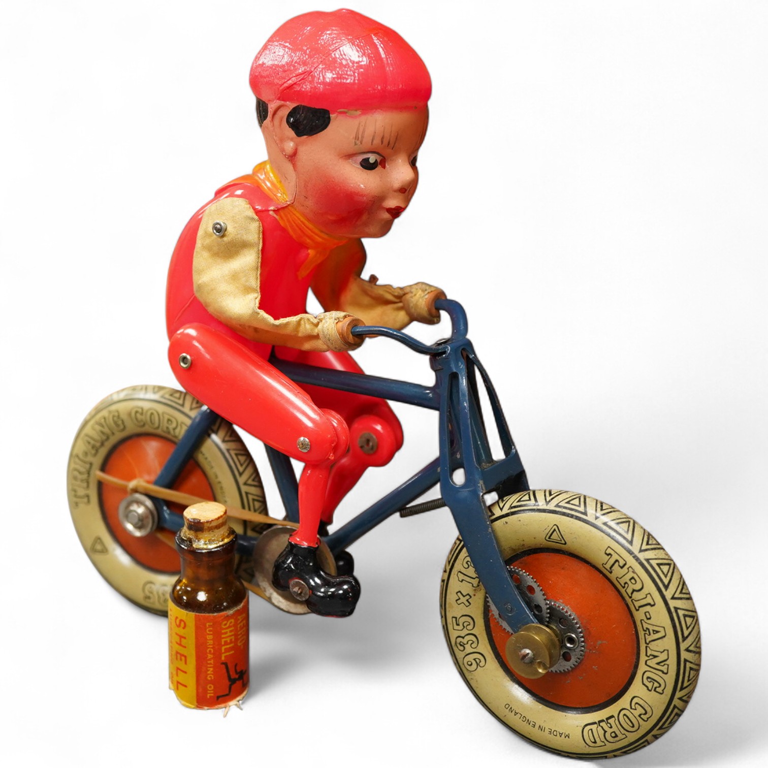An early boxed Tri-ang Gyro-Cycle, with a gyroscope contained within the front wheel of the bicycle, providing power to the toy, template bicycle with celluloid rider, the box with original inner card holder and a sealed